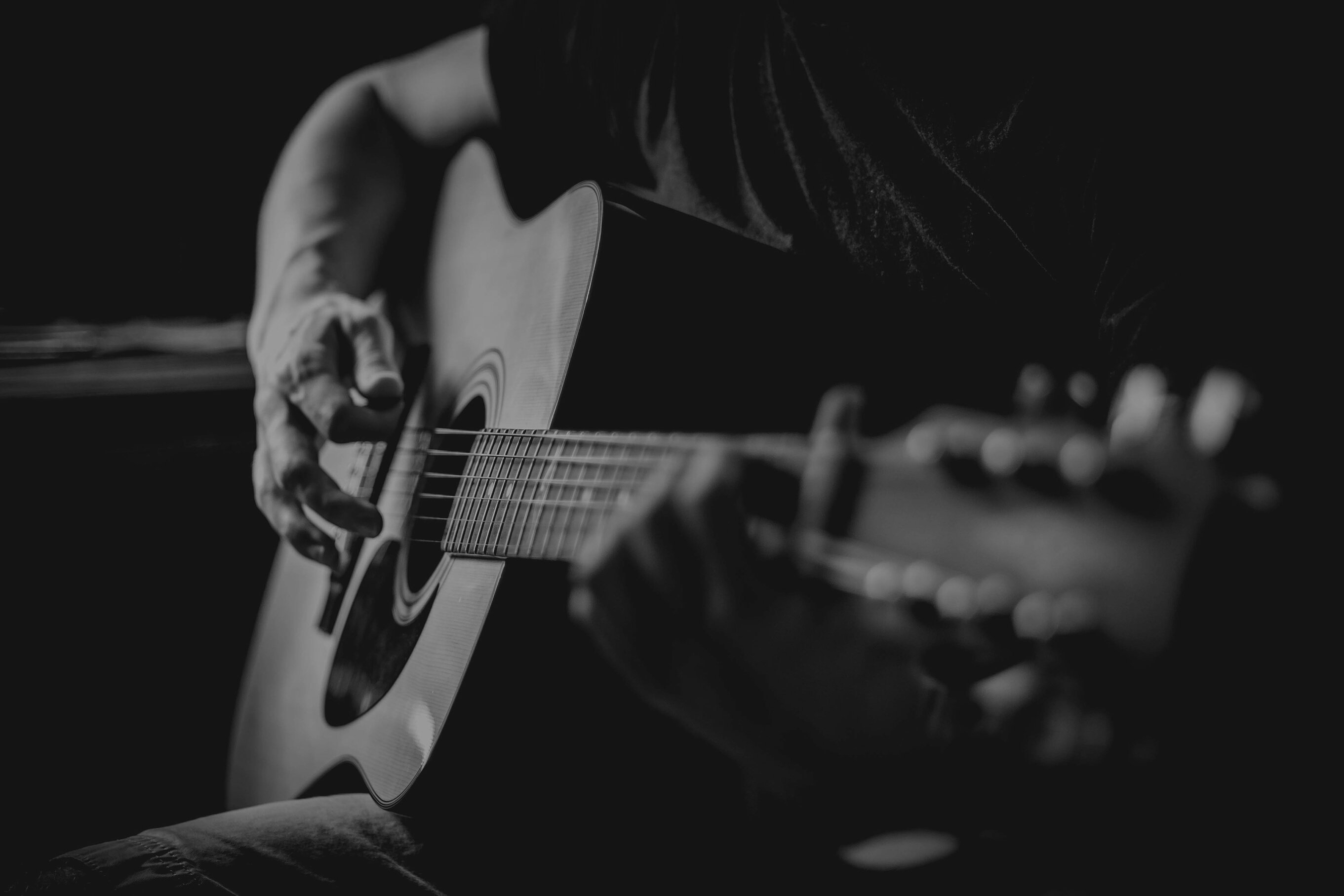 Man Playing An Acoustic Guitar